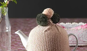 Funda con borlones para tetera