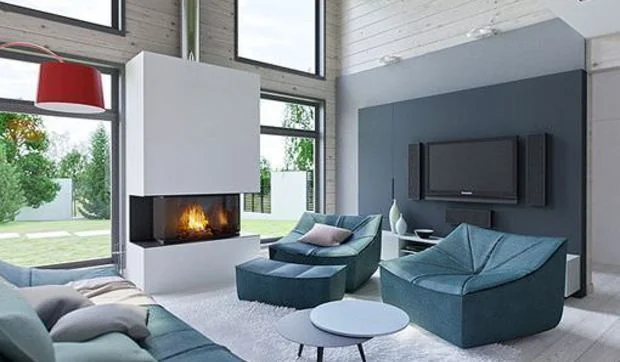 Salón, comedor y cocina integrados en un espacio de doble altura